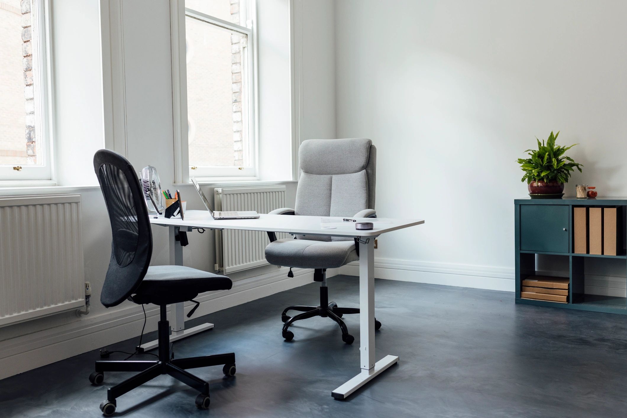 Quiet office interior with desk and chairs