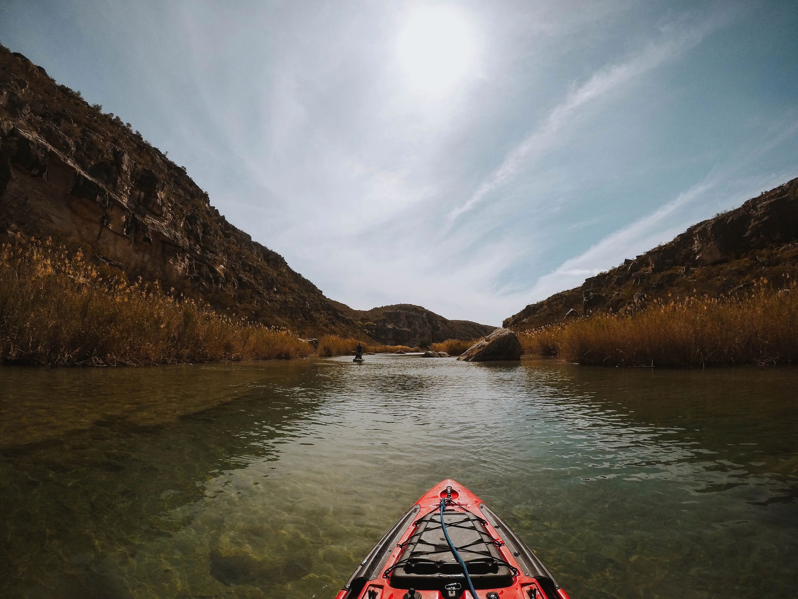 Kayaking on a calm river at daybreak