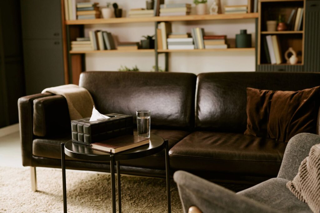 Empty Psychologist Office Showing Therapy Couch and Table with Tissues